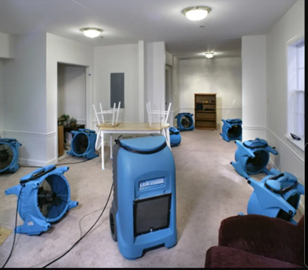 Air movers and dehumidifier setup for Water Damage Restoration in Bryan